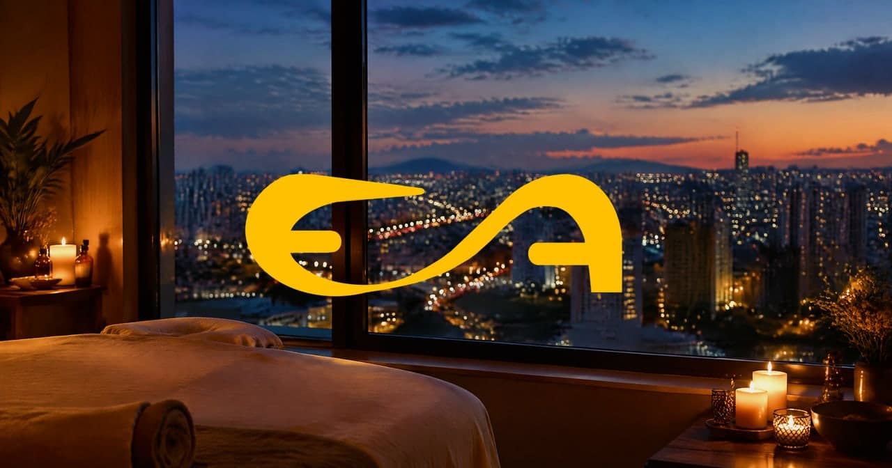 Sala de massagem à luz de velas com vista para o horizonte da Zona Leste ao entardecer
